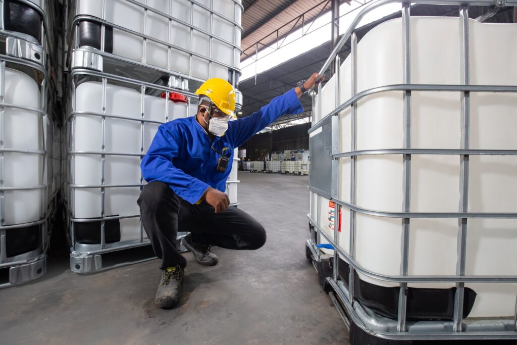 Ranama industrial container operation with drums and processing equipment.